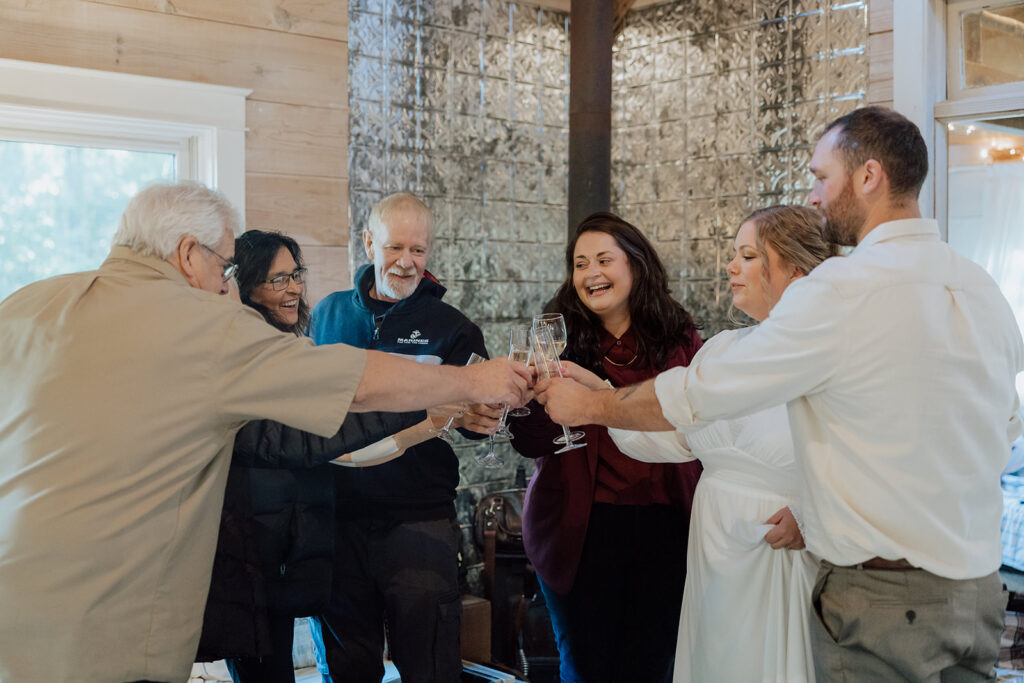 family toasting after an elopement ceremony

