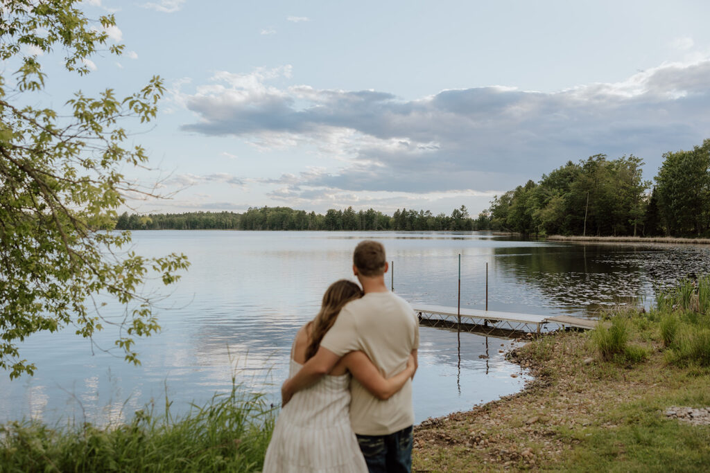 couple looking out at a lake in northern wi